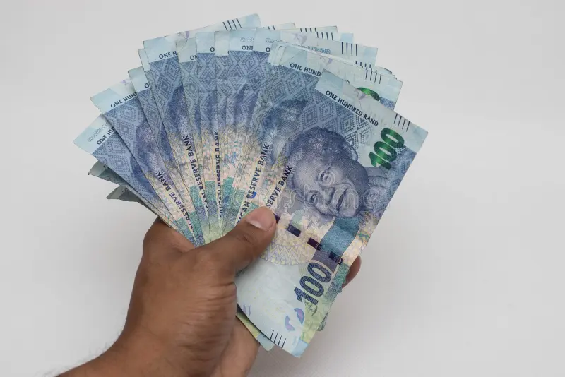 hand holding south african rands notes 144943861
